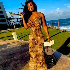 A serpentine print dress small medium & large